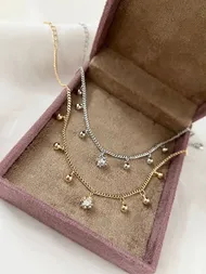 پابند آویزدار گوی نگین‌دار