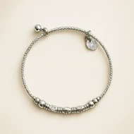 دستبند زنانه نقره‌ای مهره‌ای با آویز دایره‌ای شیک