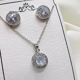 نیم‌ست استیل نقره‌ای طرح «خورشیدی گرد» (گردنبند + گوشواره) | اقتصادی و درخشان