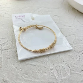 دستبند زنانه طرح طلا با گوی‌های برجسته برند ژوپینگ
