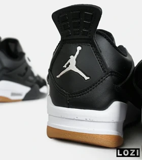 کتانی ساق‌دار بزرگ پا مشکی سفید Nike air jordan 4