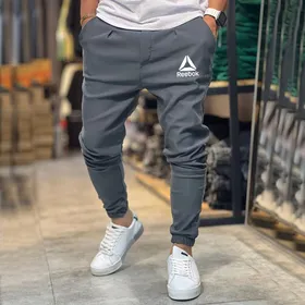 شلوار مردانه مدل اسلش بنگال کش رنگ طوسی تیره ریبوک reebok