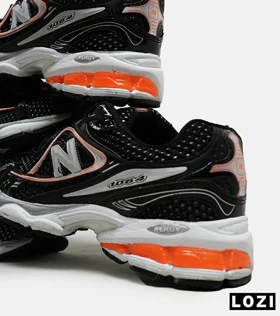 کفش کتانی مردانه و زنانه مشکی نارنجی NEW BALANCE 1064