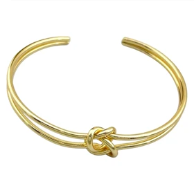دستبند النگویی زنانه مدل ناتل طرح طلا با گره مینیمال