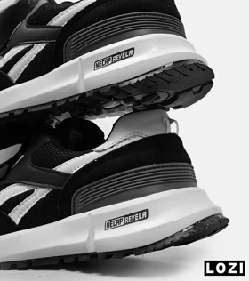 کفش کتانی مشکی سفید REEBOK Unphased Pro