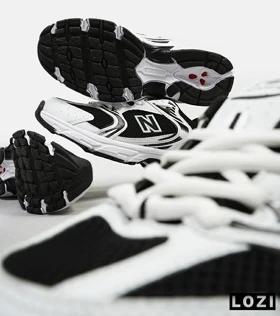 کفش کتانی مردانه و زنانه سفید مشکی NEW BALANCE 530