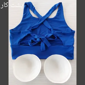 نیم‌تنه ورزشی زنانه پشت گره‌ای نایک