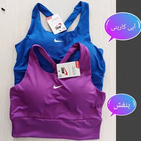 نیم‌تنه ورزشی زنانه پشت گره‌ای نایک