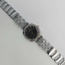 ساعت مچی زنانه مجلسی ریلانس Riluns نگین‌دار با موتور کوارتز (بند نقره ای صفحه مشکی 1)