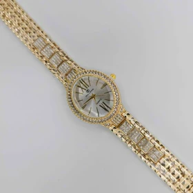 ساعت مچی زنانه مجلسی ریلانس Riluns نگین‌دار با موتور کوارتز (بند طلایی صفحه سفید)