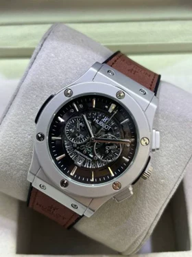 ساعت مردانه هابلوت بند قهوه ای قاب نقره ای