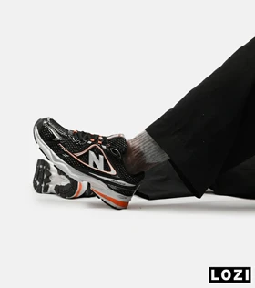 کفش کتانی مردانه و زنانه مشکی نارنجی NEW BALANCE 1064