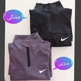 بلوز نیم زیپ فینگردار نایک زنانه
