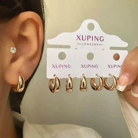 گوشواره حلقه‌ای مدل آبکاری طلا ژوپینگ با طراحی چشم نواز