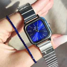 ساعت Daniel Wellington با صفحه آبی خورشیدی و بند استیل نقره‌ای