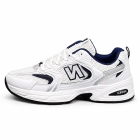 کتانی خارجی مردانه مدل نیوبالانس 530 سفید سرمه ای New Balance