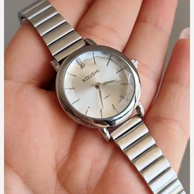 ساعت مچی زنانه کوشی شیشه الماسی بند استیل ریلیباتری اضافی