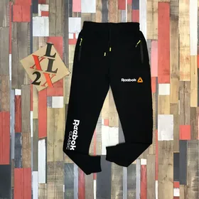 شلوار اسلش مردانه Reebok نارنجی رنگ مشکی