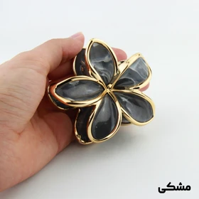 کلیپس دخترانه مدل سنگی طرح گل دور طلایی (مشکی)