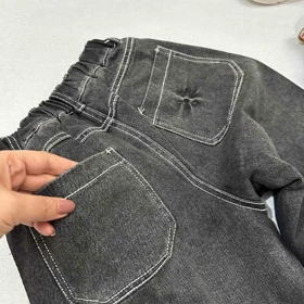 شلوار جین سنگ شور شده با دوخت سفید