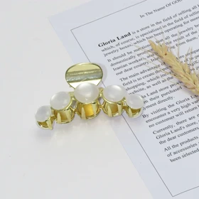 کلیپس مو زنانه مدل مرواریدی شفاف کد 1380