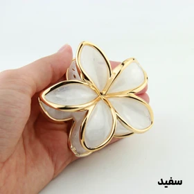 کلیپس دخترانه مدل سنگی طرح گل دور طلایی (سفید)