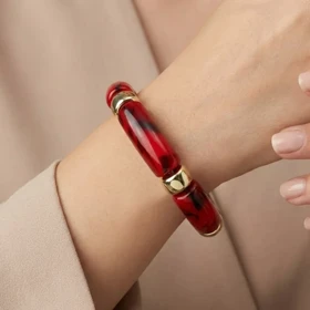 دستبند زنانه بنگل رزینی چندتکه مدل روبینورا یاقوتی‑طلایی