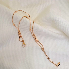 دستبند ژوپینگ مدل «البرنادو» (دوریکا) | رقص گوی‌های طلایی دور مچ