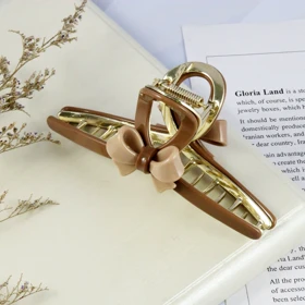 کلیپس مو زنانه مدل فلزی پاپیونی کد G_Lnd_1493