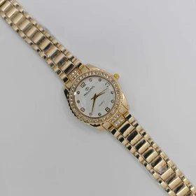 ساعت مچی زنانه مجلسی ریلانس Riluns نگین‌دار با موتور کوارتز (بند طلایی صفحه سفید)