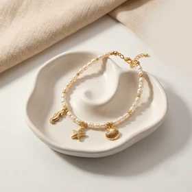 پابند مرواریدی با چارم طلایی