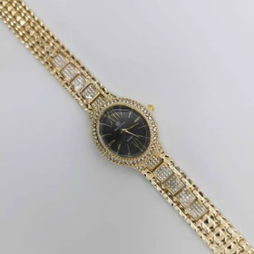 ساعت مچی زنانه مجلسی ریلانس Riluns نگین‌دار با موتور کوارتز (بند طلایی صفحه مشکی)