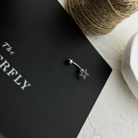 پیرسینگ ناف ستاره جواهری استیل - درخشش بی‌انتها