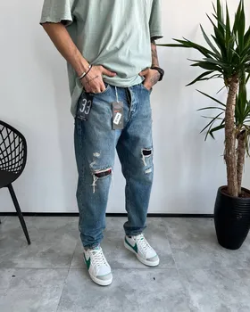 شلوار مام فیت رنگ خاص زاپ‌دار LEVIS