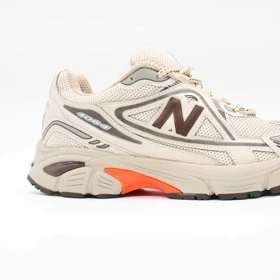 کتانی نیوبالانس 1064 کرم نارنجی کد 5454