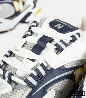 کفش کتانی مردانه و زنانه طوسی زرد مشکی NEW BALANCE 725 مدل 7387