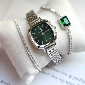 ساعت مچی زنانه DW آینه ای صفحه سبز تیره بند سیلور