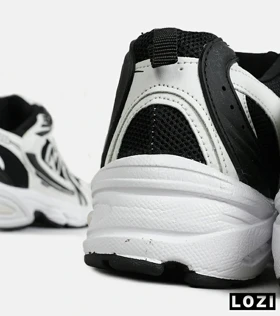 کفش کتانی مردانه و زنانه سفید مشکی NEW BALANCE 530 مدل 6985
