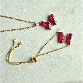 دستبند و گردنبند پروانه سواروسکی قرمز اناری