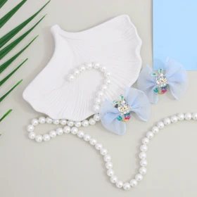 گل سر پری دریایی آبی – عروسکی با پاپیون‌های آبی