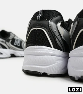 کفش کتانی مردانه و زنانه مشکی نقره ای NEW BALANCE 530 مدل 5508