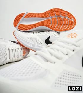 کفش کتانی مردانه سفید نارنجی Nike guide 10