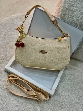 کیف دوشی و دستی دخترانه کوچ چاپدار (کرم)