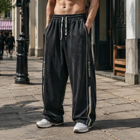 شلوار اسلش بگ مردانه طرح گرافیکی خطدار تنخور آزاد و خاص (Oversized