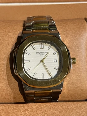 ساعت مردانه طرح پتک فیلپ نقره ای طلایی