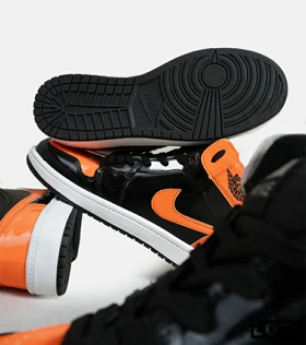 کفش کتانی مردانه و زنانه ساق‌دار مشکی نارنجی ورنی NIKE jordan 1