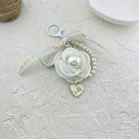 آویز کیف شیک چارم بگ طرح گل و مروارید