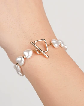 دستبند مروارید قلبی رنگ طلایی با قفل T برند ژوپینگ