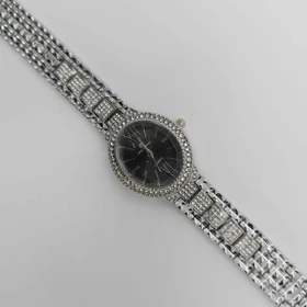 ساعت مچی زنانه مجلسی ریلانس Riluns نگین‌دار با موتور کوارتز (بند نقره ای صفحه مشکی 1)