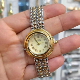 ساعت مچی زنانه کارتیر Cartier موتور کوارتز باکیفیت و طراحی زیبا (بند نقره ای طلائی با صفحه طلائی)